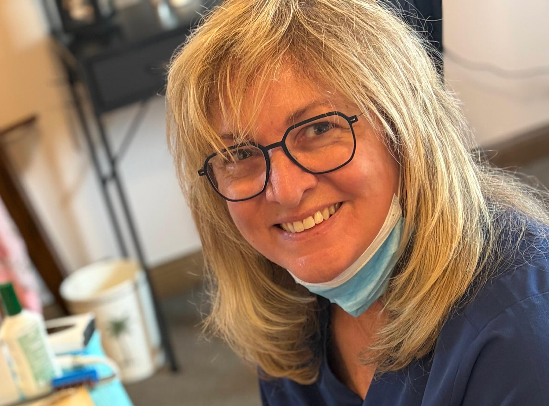 Julie Ethan, RN, smiling at the camera after providing in-home foot care.